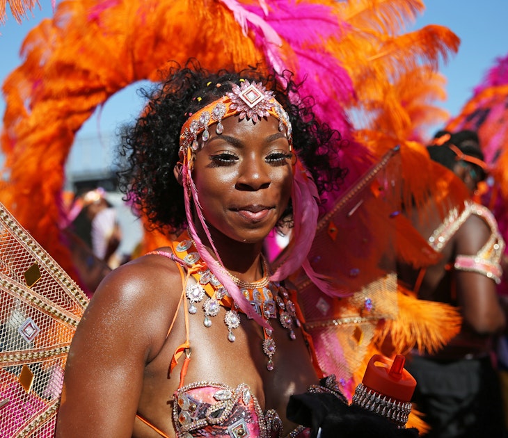 A dancer performs during the the Notting Hill Carnival in west London. (Photo by Hollie Adams/PA Images via Getty Images)